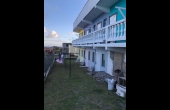 Back of property with clothes line