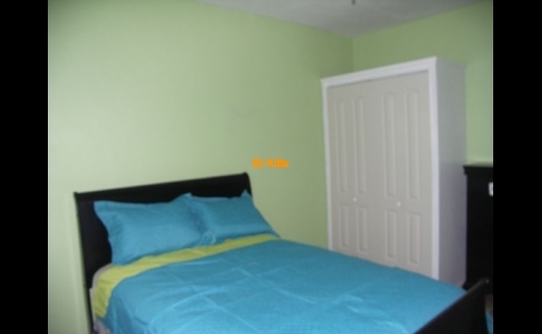 Bedroom with view of cupboard