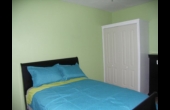 Bedroom with view of cupboard